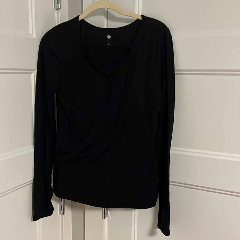 Black long sleeve shirt with criss cross ties in front in size medium